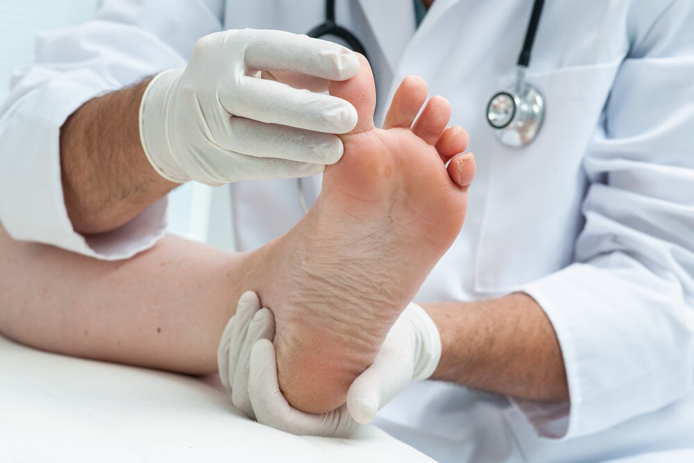 Doctor inspecting a foot