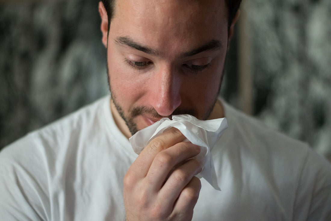 Man wiping mouth with napkin
