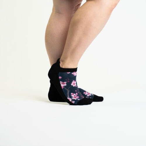 A person wearing blossom socks