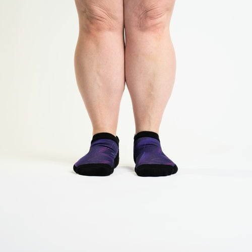 A model showcasing purple ankle socks