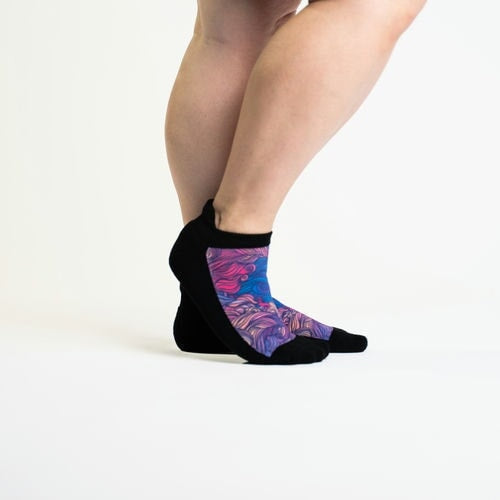 A person wearing wild  winds ankle socks