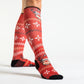 A model in rudolph Christmas socks