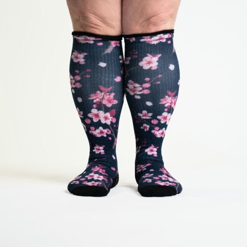 A person wearing pink floral socks