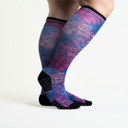 A person wearing wild compression socks