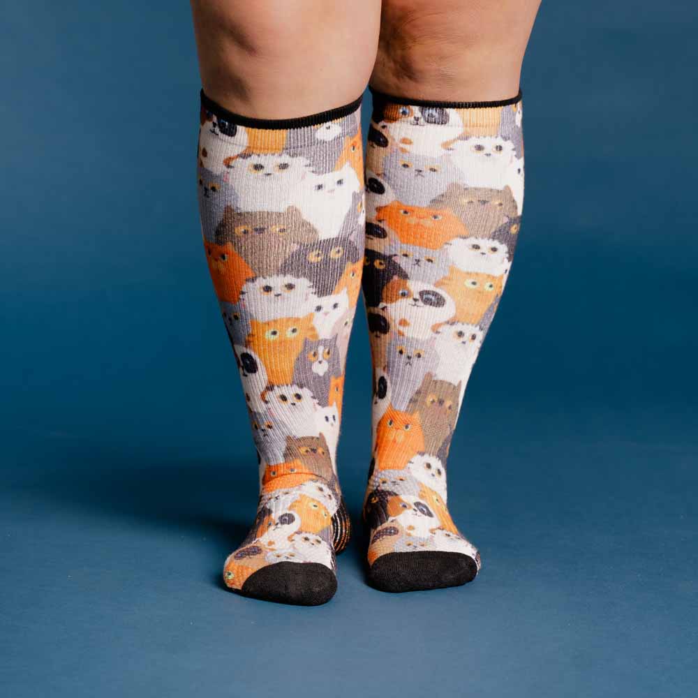 A person wearing cats print compression socks