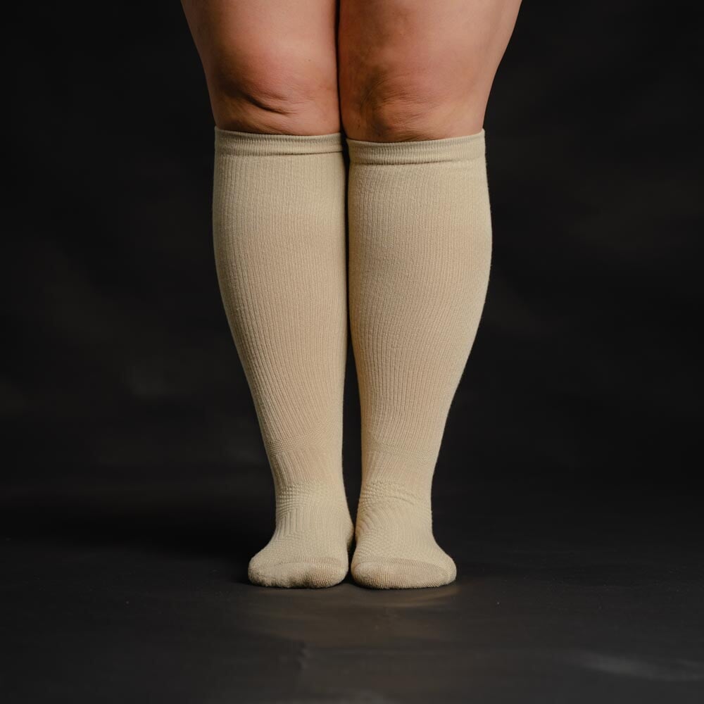 A person wearing tan socks