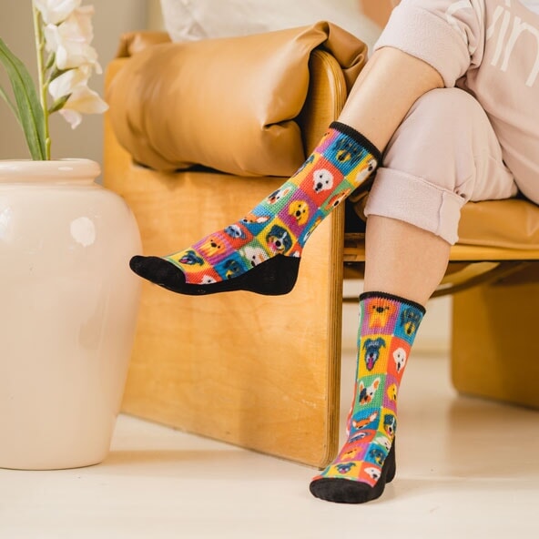 A person wearing dogs pattern non-binding socks