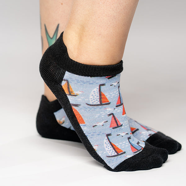 Two feet wearing boats pattern ankle diabetic socks