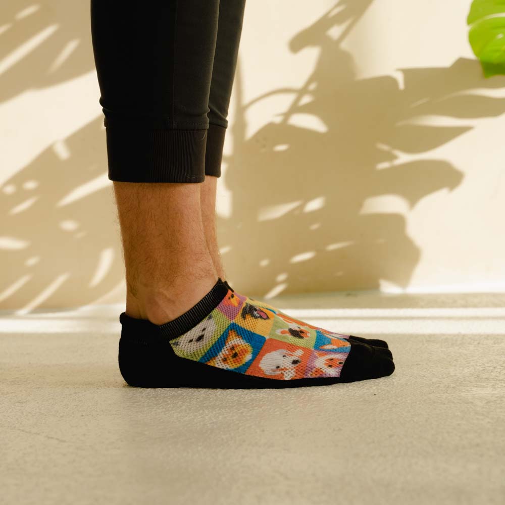 A person wearing dog printed ankle socks
