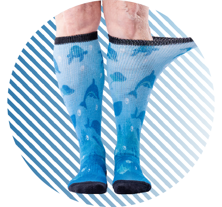 Two legs wearing blue diabetic socks with a side of a sock being stretched