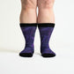 A person wearing non-binding purple socks