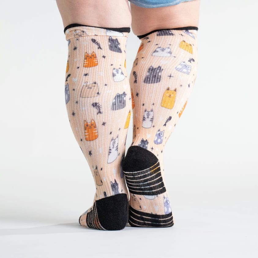 A model wearing compression Funny cat socks