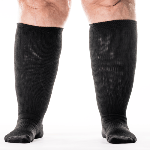 A person wearing black diabetic socks