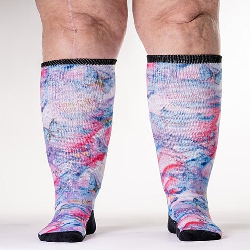 A person wearing butterfly pattern non-binding socks