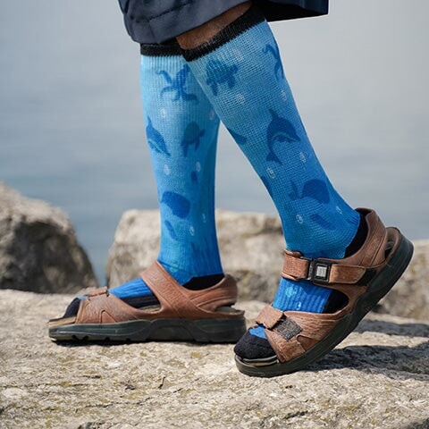 A person walking in deep sea pattern diabetic socks
