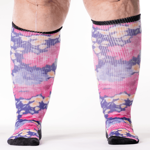 A person wearing floral knee-high non-binding socks