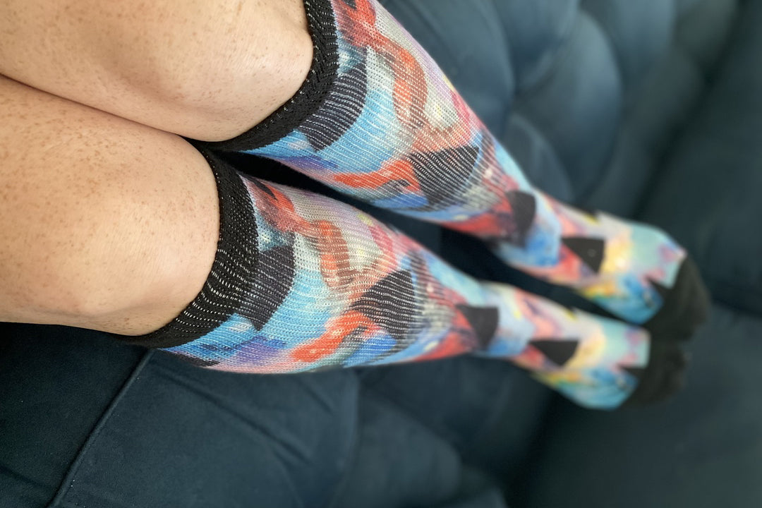 Legs of a lady wearing floral non-binding diabetic socks