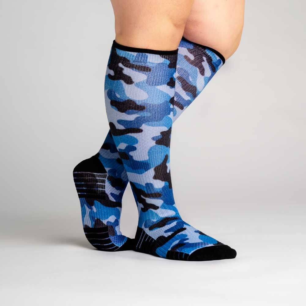 A person wearing blue camo pattern compression socks