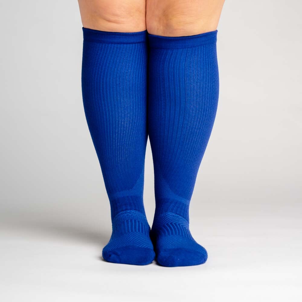 A person wearing blue diabetic compression socks