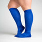 A person wearing blue compression socks