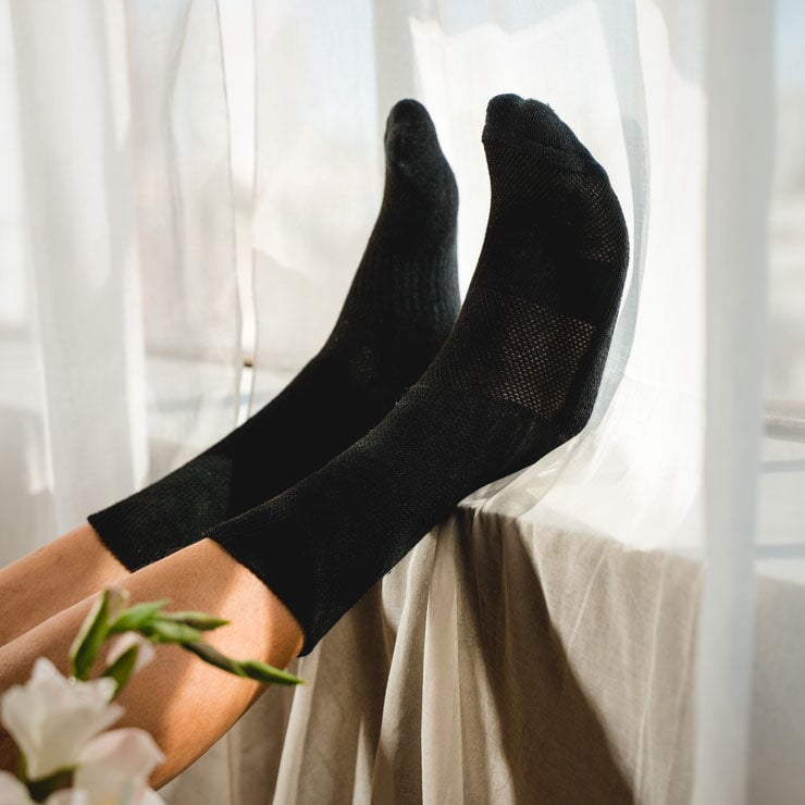 A person wearing black non-binding socks