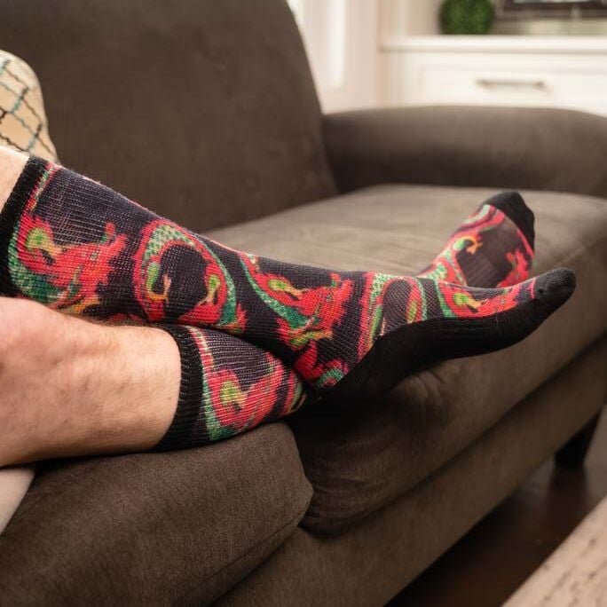 A person wearing diabetic dragon pattern socks