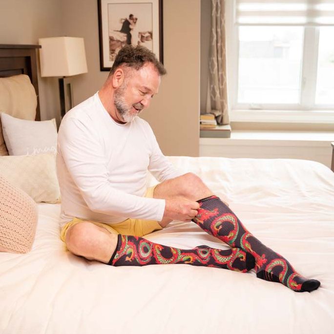 A man wearing compression dragon socks