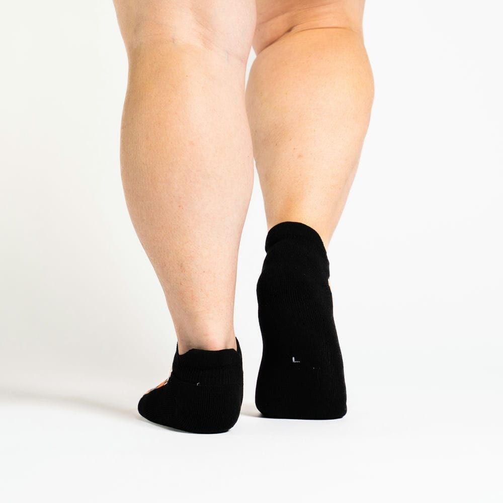 A person walking in ankle socks