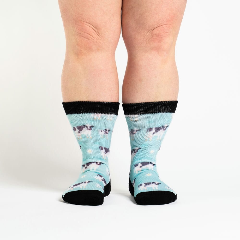 A person wearing crew cow socks