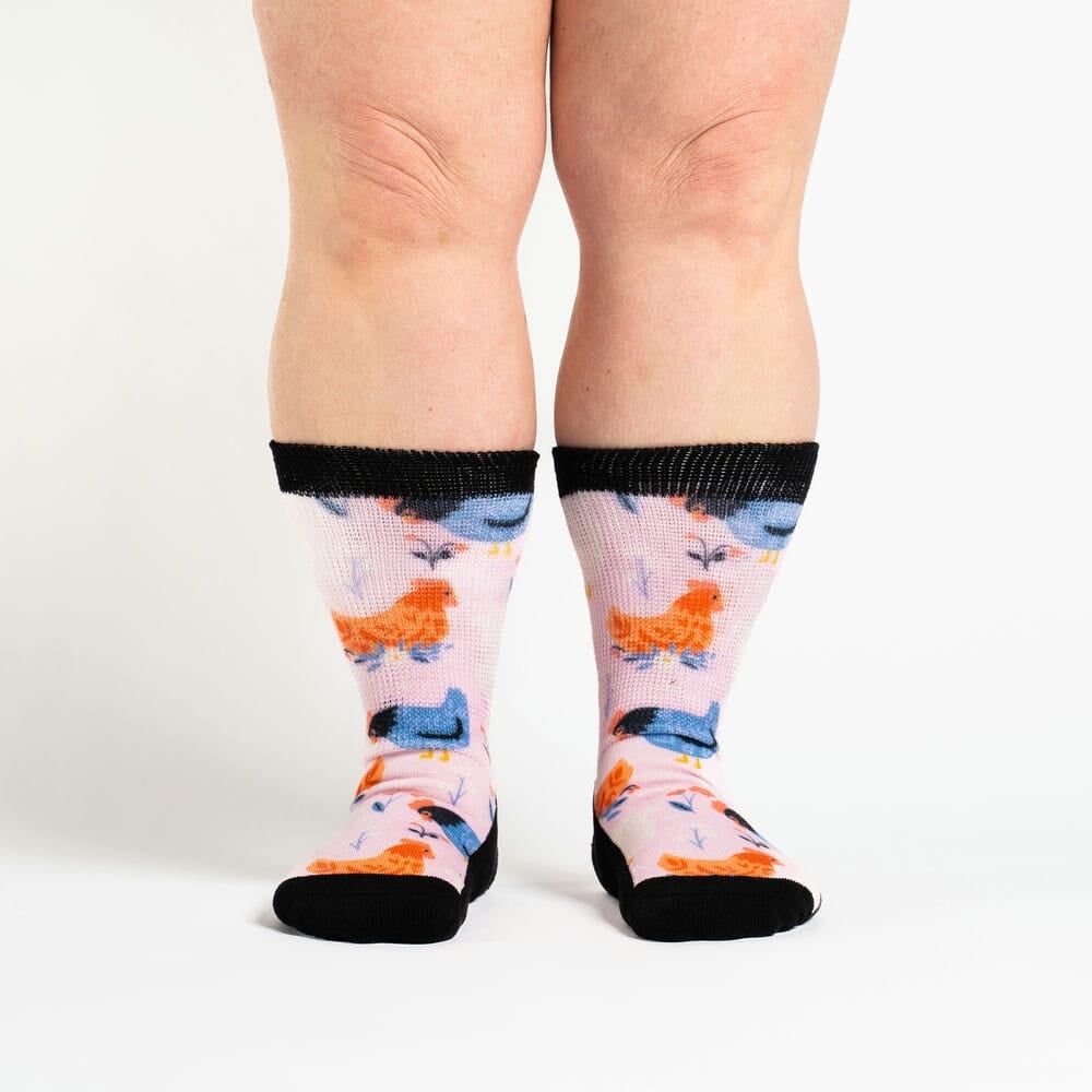 A person wearing crew chicken socks
