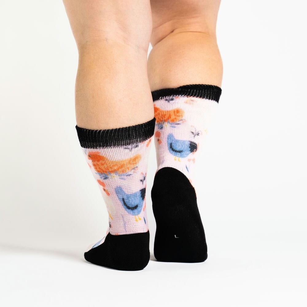 A person wearing stretchy chicken socks